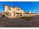 Expansive backyard featuring a large patio and grass at 18147 W Desert View Ln, Goodyear, AZ 85338