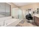 Spacious bathroom with soaking tub, shower, and double vanity at 18147 W Desert View Ln, Goodyear, AZ 85338