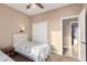 Bedroom with twin beds and access to another room at 18147 W Desert View Ln, Goodyear, AZ 85338