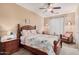 Bedroom with wooden bed frame and seating area at 18147 W Desert View Ln, Goodyear, AZ 85338