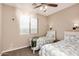 Bedroom with twin beds and a ceiling fan at 18147 W Desert View Ln, Goodyear, AZ 85338