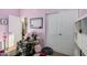 Bedroom with comfortable armchair and built-in shelving at 18147 W Desert View Ln, Goodyear, AZ 85338