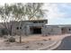 Modern community clubhouse entrance with stone and glass at 18147 W Desert View Ln, Goodyear, AZ 85338