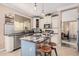 Spacious kitchen with granite countertops, stainless steel appliances, and farmhouse-style cabinets at 18147 W Desert View Ln, Goodyear, AZ 85338