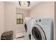 Bright laundry room complete with washer and dryer at 18147 W Desert View Ln, Goodyear, AZ 85338