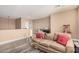 Cozy loft area with sofa and built-in shelving at 18147 W Desert View Ln, Goodyear, AZ 85338