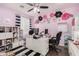 Home office with built-in shelving and a desk at 18147 W Desert View Ln, Goodyear, AZ 85338
