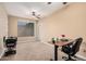 Spacious home office with standing desk and chair at 18147 W Desert View Ln, Goodyear, AZ 85338