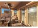Covered patio with comfortable seating and heater at 18147 W Desert View Ln, Goodyear, AZ 85338