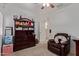 Bedroom featuring a dresser, recliner, and plenty of storage at 18239 N Cook Dr, Maricopa, AZ 85138