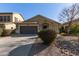 One-story house with brown garage door and landscaped front yard at 18239 N Cook Dr, Maricopa, AZ 85138