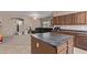 Spacious kitchen with island, ample cabinetry, and stainless steel appliances at 18239 N Cook Dr, Maricopa, AZ 85138