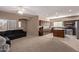 Open kitchen with island and stainless steel appliances at 18239 N Cook Dr, Maricopa, AZ 85138