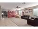 Spacious living room with tile floors and baseball memorabilia at 18239 N Cook Dr, Maricopa, AZ 85138