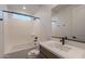 Bathroom with a bathtub, single vanity, and window at 21259 E Sparrow Dr, Queen Creek, AZ 85142