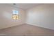 Simple bedroom with window and carpet at 21259 E Sparrow Dr, Queen Creek, AZ 85142