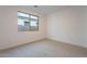 Simple bedroom with neutral wall and carpet at 21259 E Sparrow Dr, Queen Creek, AZ 85142