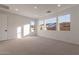 Bright bedroom with carpet flooring and multiple windows at 21259 E Sparrow Dr, Queen Creek, AZ 85142