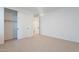 Well-lit bedroom featuring a large closet and carpet at 21259 E Sparrow Dr, Queen Creek, AZ 85142