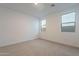 Bright bedroom with neutral walls and carpeted floor at 21259 E Sparrow Dr, Queen Creek, AZ 85142