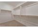 Large walk-in closet with double hanging rods at 21259 E Sparrow Dr, Queen Creek, AZ 85142
