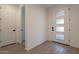 Bright and airy entryway with wood-look tile flooring at 21259 E Sparrow Dr, Queen Creek, AZ 85142
