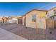 Modern stucco home with landscaping and a two-car garage at 21259 E Sparrow Dr, Queen Creek, AZ 85142