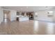 Open concept kitchen with island, modern cabinetry, and hardwood floors at 21259 E Sparrow Dr, Queen Creek, AZ 85142