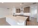 Modern kitchen with island, stainless steel appliances, and white cabinetry at 21259 E Sparrow Dr, Queen Creek, AZ 85142