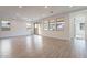 Open living room with hardwood floors and access to backyard at 21259 E Sparrow Dr, Queen Creek, AZ 85142