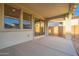 Covered patio with sliding glass doors, leading to backyard at 21259 E Sparrow Dr, Queen Creek, AZ 85142