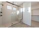 Spacious shower with glass enclosure and built-in seat at 21259 E Sparrow Dr, Queen Creek, AZ 85142