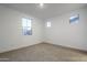 Bright bedroom with neutral carpet and large window at 21290 E Sparrow Dr, Queen Creek, AZ 85142