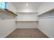 Large walk-in closet with ample shelving and hanging space at 21290 E Sparrow Dr, Queen Creek, AZ 85142