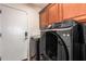 Convenient laundry room with washer, dryer, and storage at 25543 W St Kateri Dr, Buckeye, AZ 85326