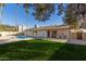 Backyard oasis with sparkling pool and patio at 2664 W Ocaso Cir, Mesa, AZ 85202