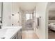 Bathroom with walk-in shower and marble tile at 2664 W Ocaso Cir, Mesa, AZ 85202