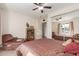 Spacious bedroom with a comfy chair and large window at 2664 W Ocaso Cir, Mesa, AZ 85202