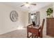 Bright bedroom with carpeted floor, desk, and large window at 2664 W Ocaso Cir, Mesa, AZ 85202