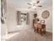 Charming bedroom with wood desk and ceiling fan at 2664 W Ocaso Cir, Mesa, AZ 85202