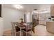 Bright dining area with table and chairs, adjacent to the kitchen at 2664 W Ocaso Cir, Mesa, AZ 85202