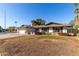Single story home with a large front yard at 2664 W Ocaso Cir, Mesa, AZ 85202