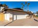 Two-car garage and wood fence at 2664 W Ocaso Cir, Mesa, AZ 85202