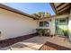 Front entry with a light green door and landscaping at 2664 W Ocaso Cir, Mesa, AZ 85202