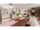 Bright kitchen features stainless steel appliances and light wood cabinets at 2664 W Ocaso Cir, Mesa, AZ 85202