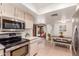 Stainless steel appliances and light cabinetry in this eat-in kitchen at 2664 W Ocaso Cir, Mesa, AZ 85202