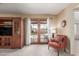 Bright living room with patio access and built-in shelving at 2664 W Ocaso Cir, Mesa, AZ 85202