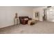 Living room with seating, display cabinet, and access to hallway at 2664 W Ocaso Cir, Mesa, AZ 85202
