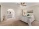Main bedroom with ensuite bathroom and ceiling fan at 2664 W Ocaso Cir, Mesa, AZ 85202