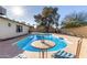 Inviting kidney-shaped pool with patio furniture and large backyard at 2664 W Ocaso Cir, Mesa, AZ 85202